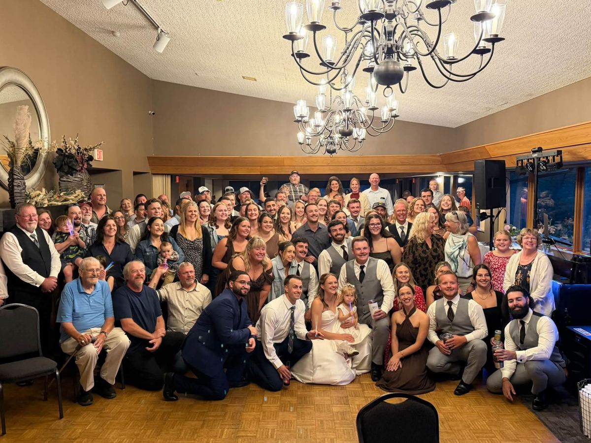 The whole wedding together at the end of the night
