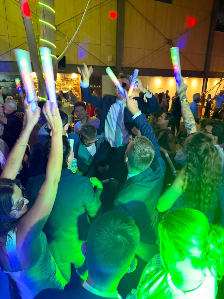 Glow sticks up on a packed dance floor
