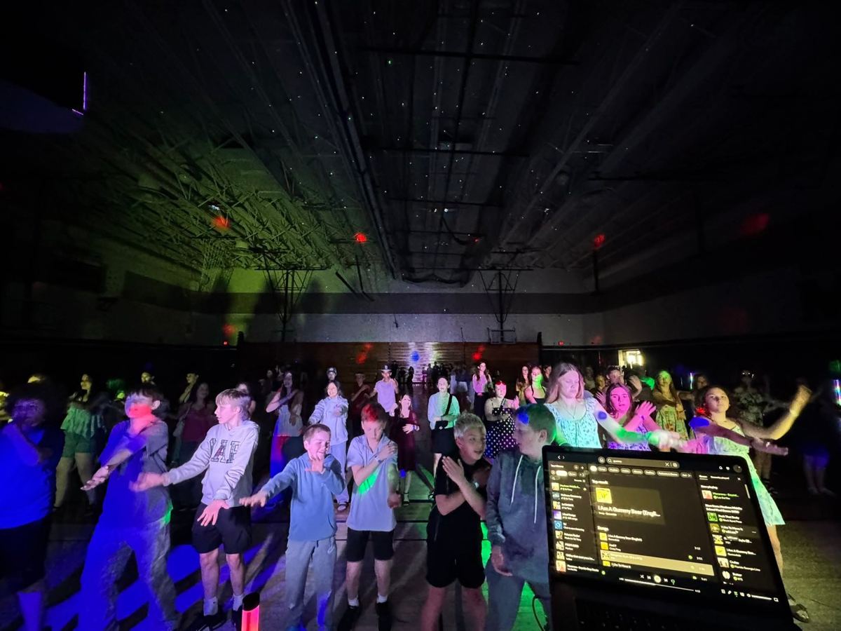 A middle school dance, everybody doing the moves
